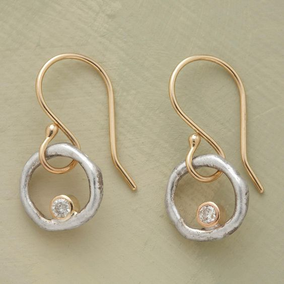 Gold and silver earrings with cubic zirconia in vintage style