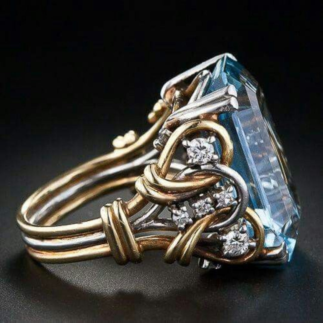 Gold ring with blue crystal in vintage style