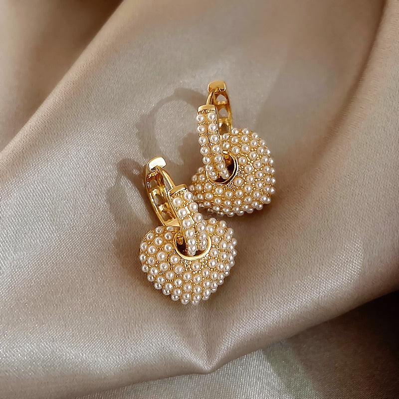 Gold flower-shaped earrings with cubic zirconia