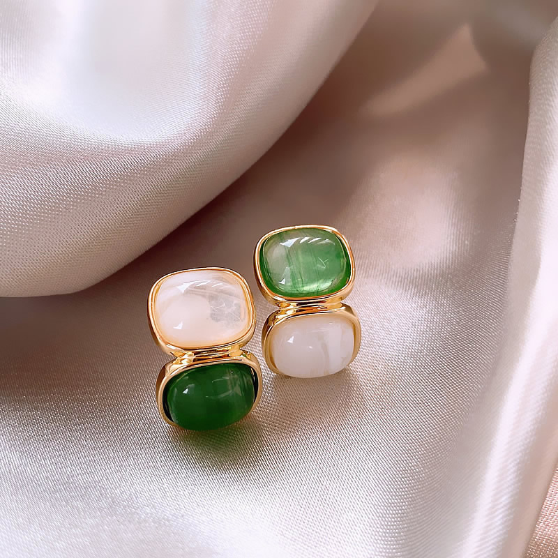 Elegant gold earrings with white and green stones