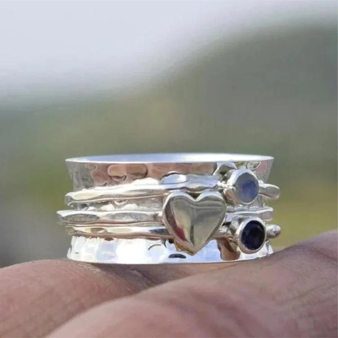 Elegant silver spinning heart ring
